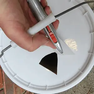 cut a hole in top of bucket